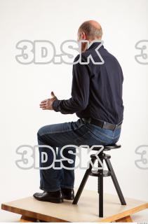 Sitting pose blue deep shirt jeans of Ed 0010